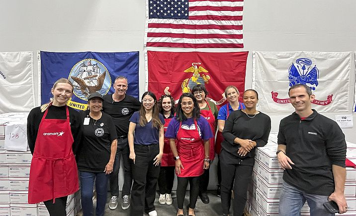 group of employees creating care packages for military members